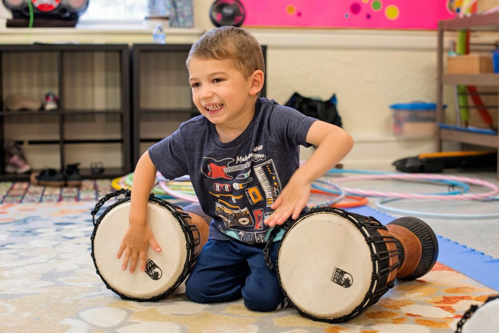 boy drumming congas