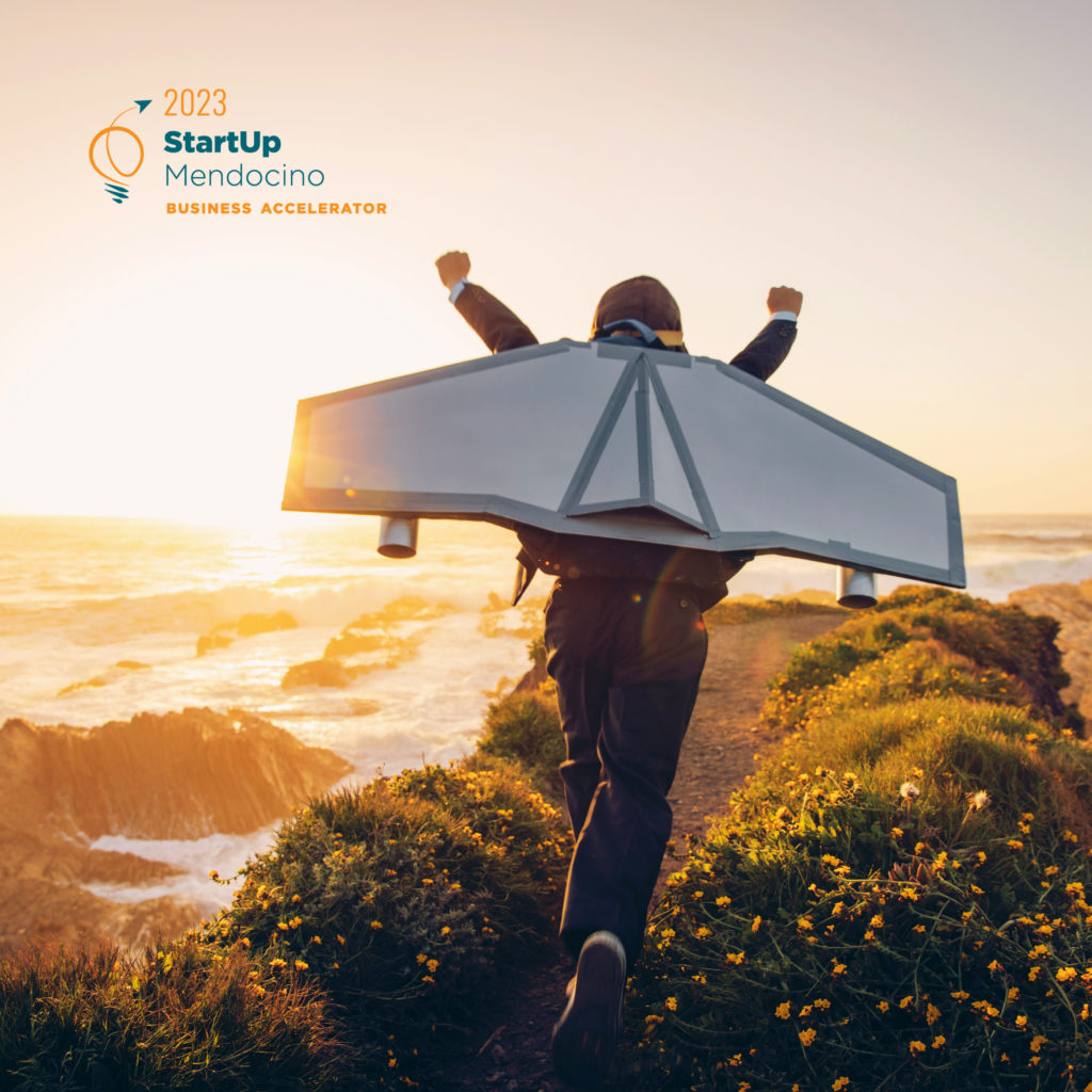 A young boy dressed in business suit and tie wears a homemade jetpack and flying goggles raises his arms in the afternoon sun while running to take off into the air on an outcropping above the surf in Montana de Oro State Park, California. This young entrepreneur is ready to take his new business to new heights.