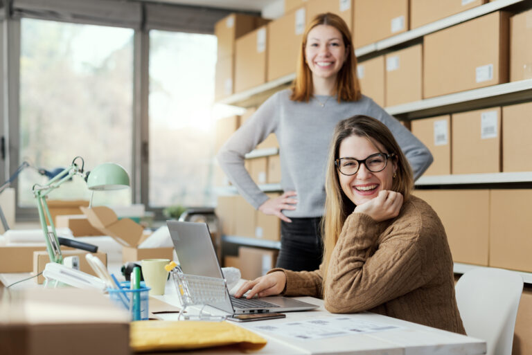 Two women sitting at computer